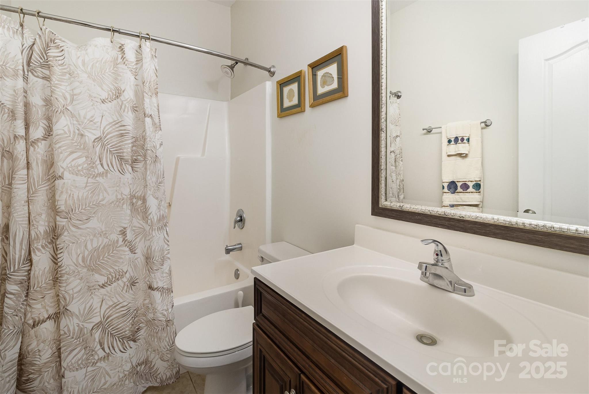 4321 Rolling Acres Road Charlotte, NC 28213 - Photo 16 of 22 a bathroom with a sink and a toilet