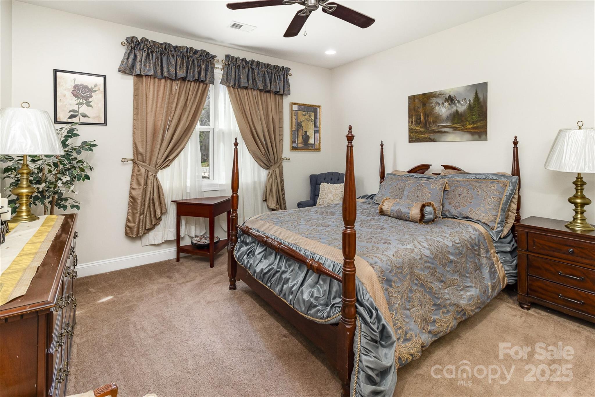 4321 Rolling Acres Road Charlotte, NC 28213 - Photo 17 of 22 a bedroom with a bed a chandelier and dresser
