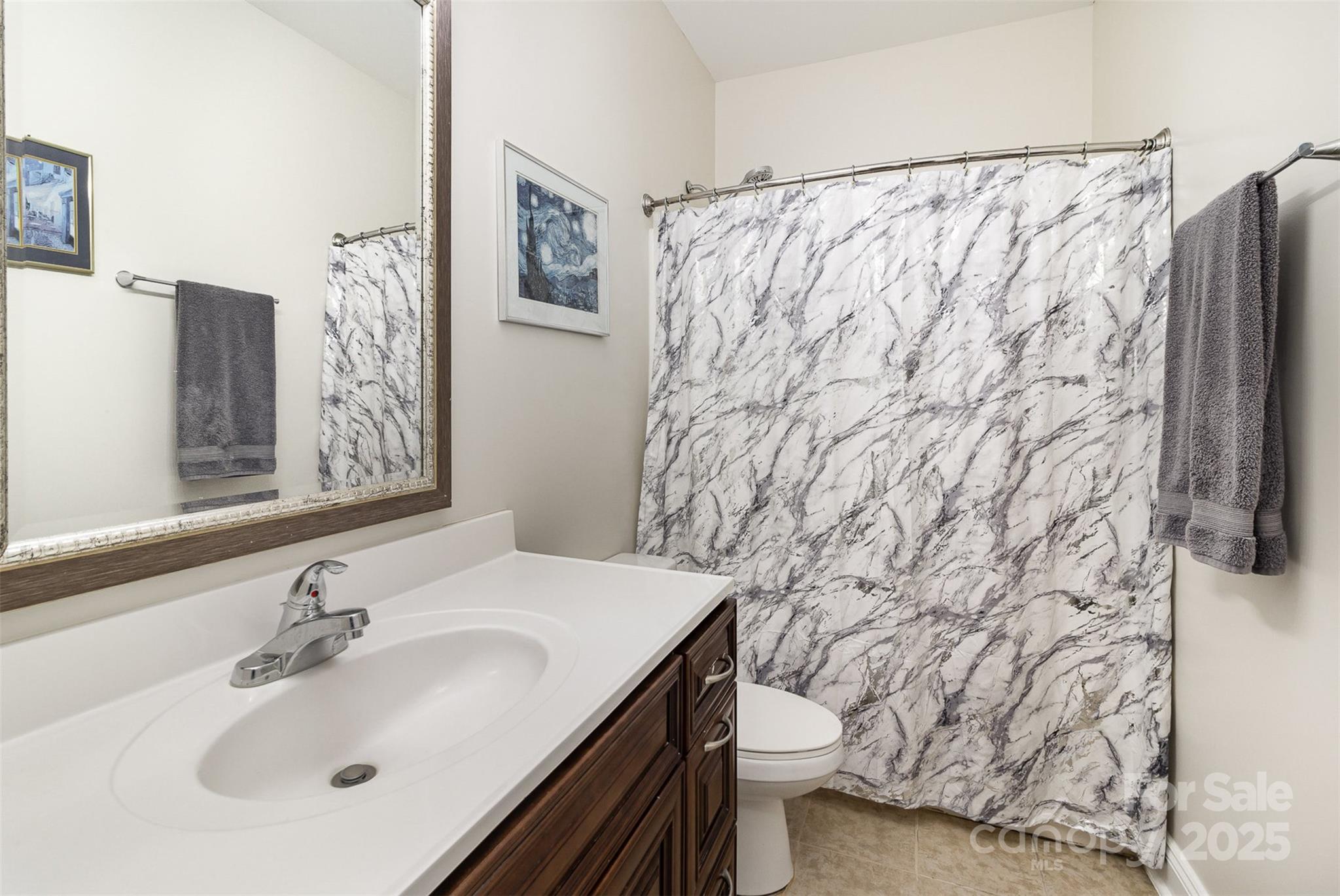 4321 Rolling Acres Road Charlotte, NC 28213 - Photo 18 of 22 a bathroom with a sink and a mirror