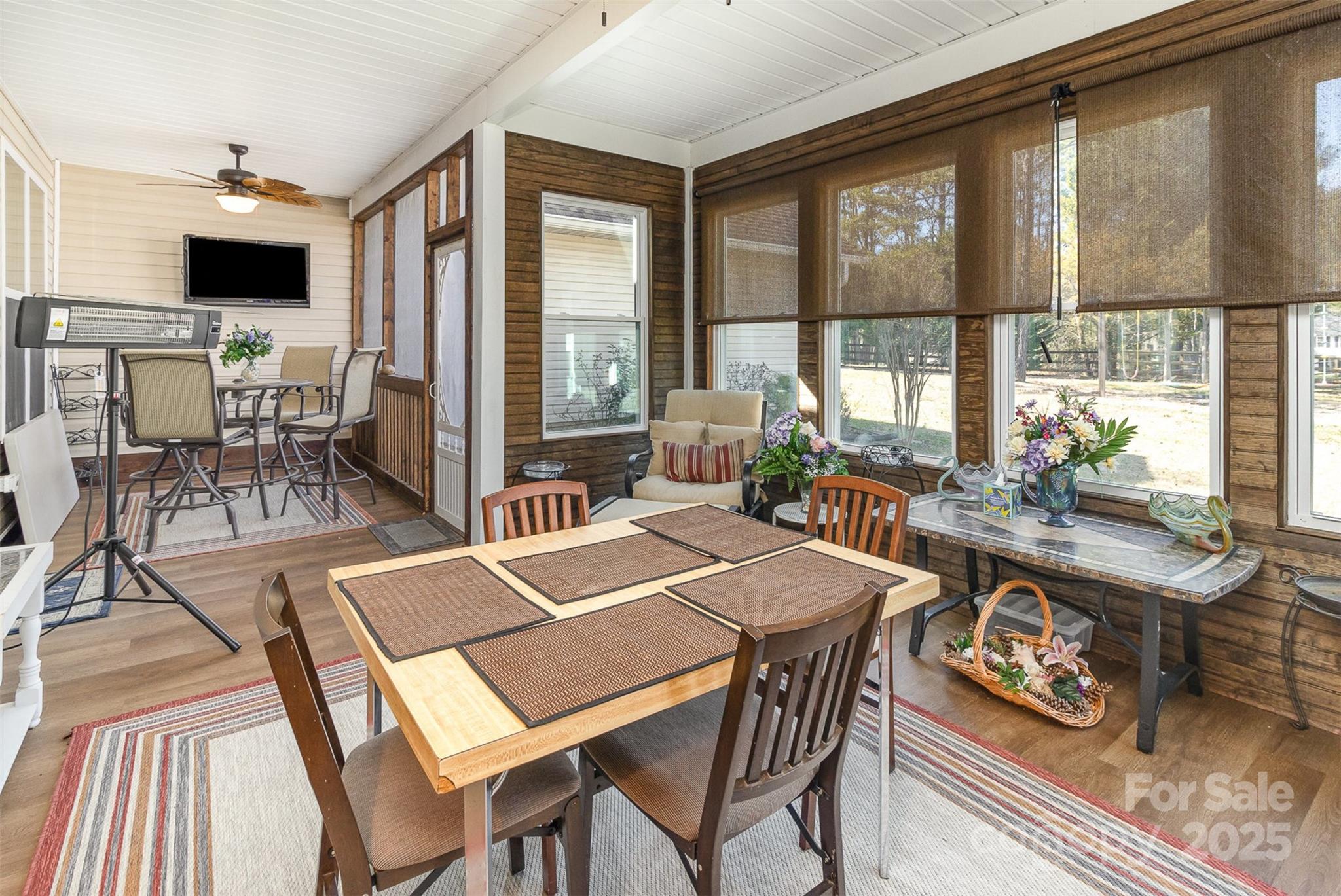 4321 Rolling Acres Road Charlotte, NC 28213 - Photo 22 of 22 a dining room with furniture a rug and a floor to ceiling window