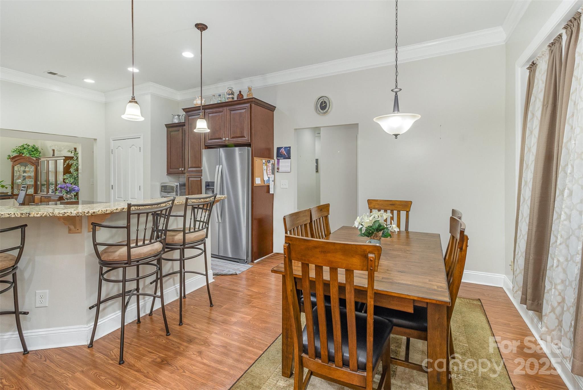 4321 Rolling Acres Road Charlotte, NC 28213 - Photo 10 of 22 a dining room with furniture and wooden floor