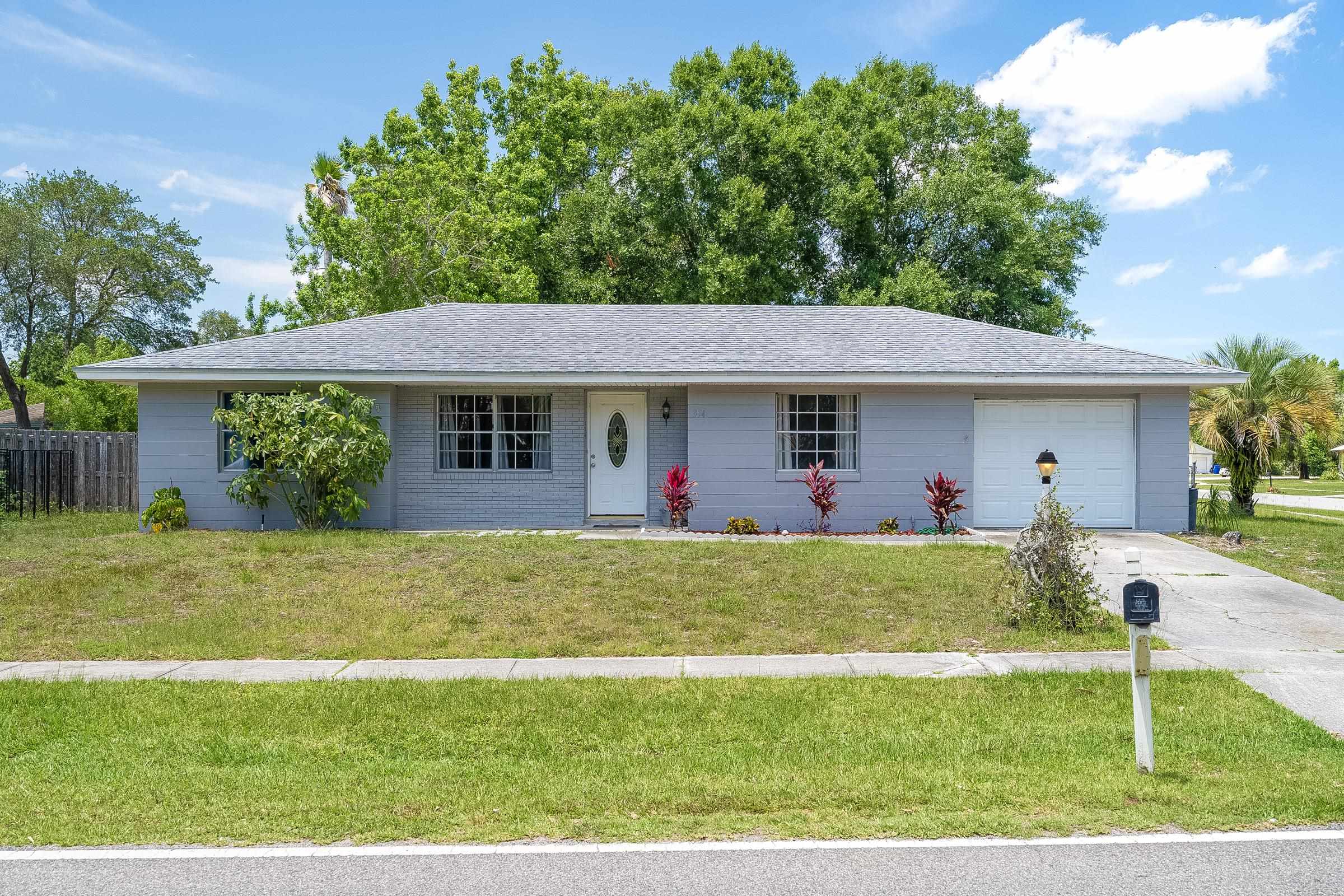 front view of a house with a yard