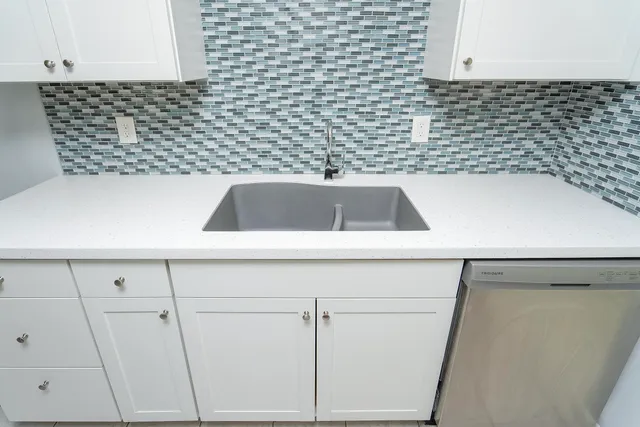 a bathroom with a sink a vanity and mirror