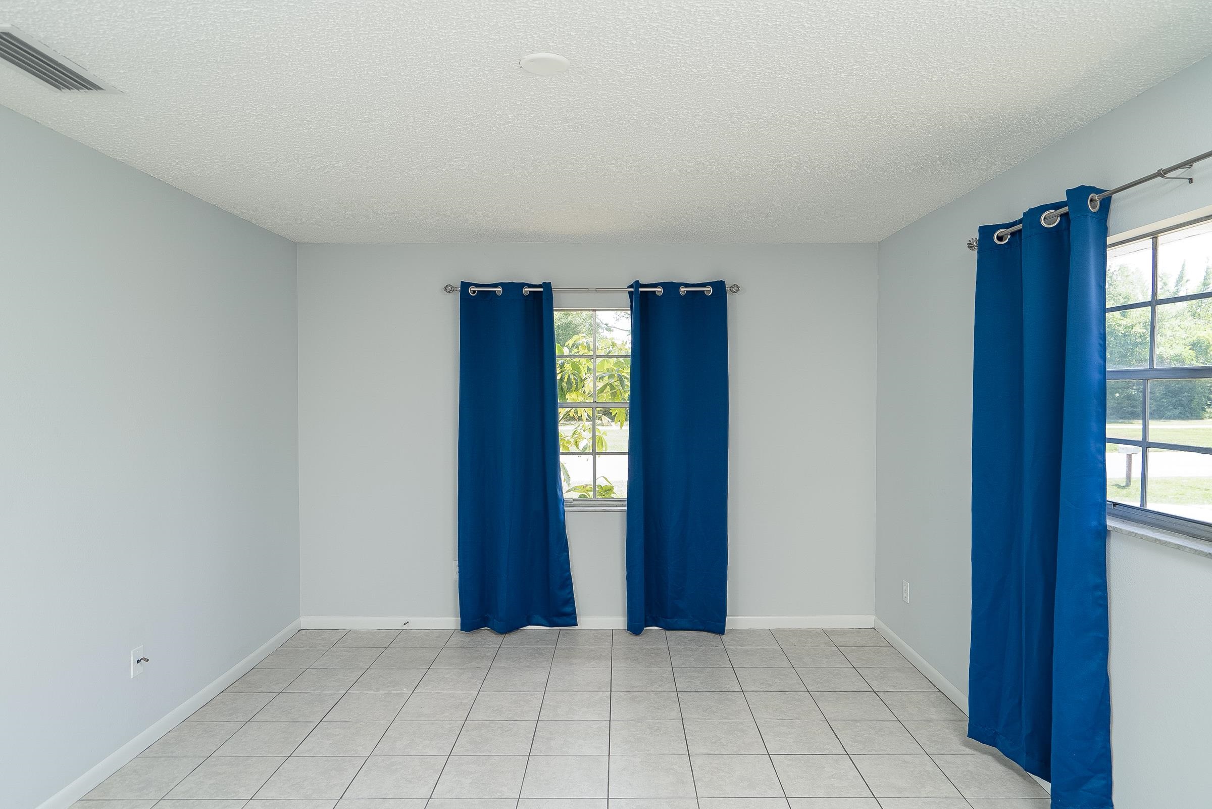 354 Shores Boulevard St. Augustine, FL 32086 - Photo 20 of 34 a view of an entryway with wooden floor and windows