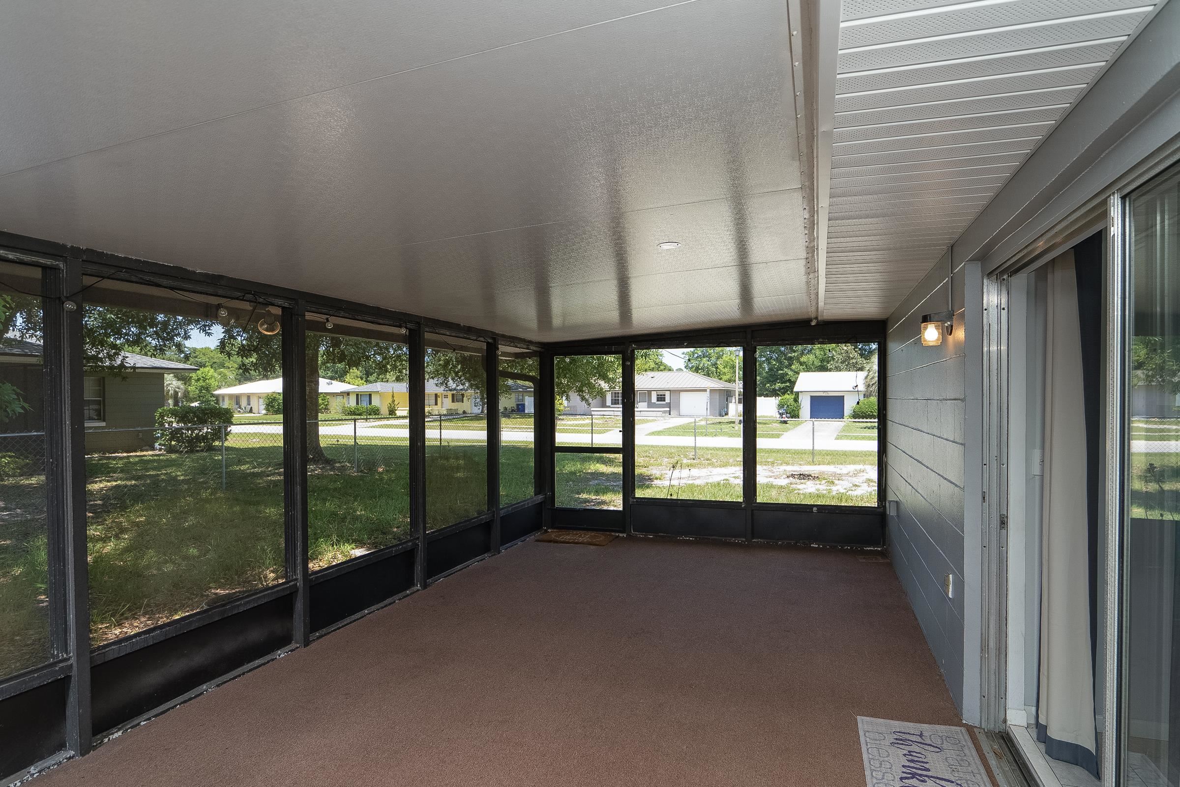 354 Shores Boulevard St. Augustine, FL 32086 - Photo 25 of 34 a view of a room with large windows