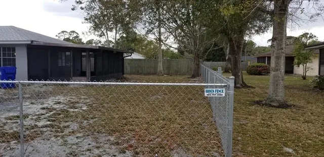 a backyard of house with trees