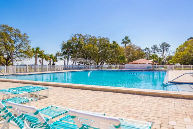 a view of swimming pool with a yard