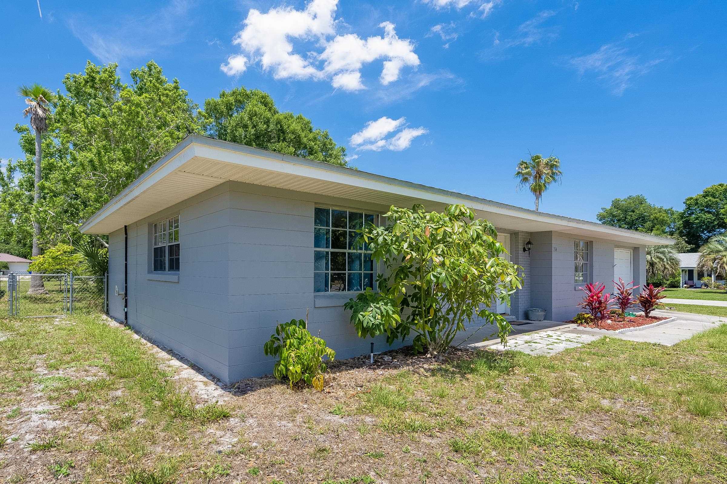 354 Shores Boulevard St. Augustine, FL 32086 - Photo 5 of 34 a front view of a house with garden