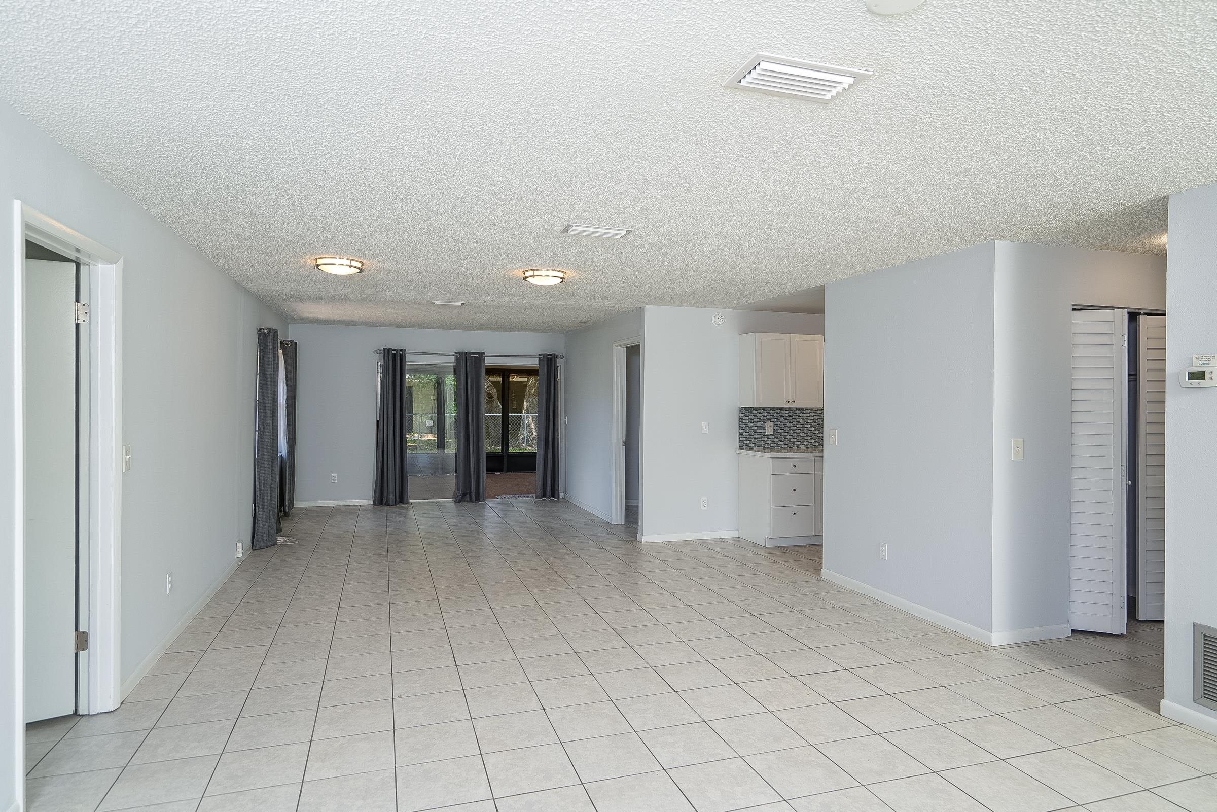 354 Shores Boulevard St. Augustine, FL 32086 - Photo 9 of 34 a view of an empty room with window