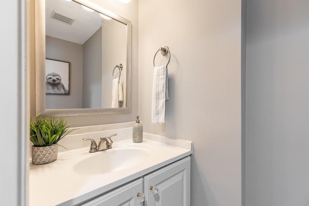 3 Elginwood Road, Unit B Peabody, MA 01960 - Photo 17 of 30 a bathroom with a granite countertop sink and a mirror