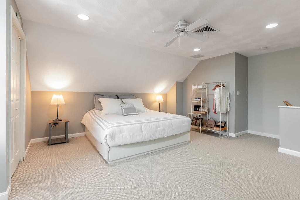 3 Elginwood Road, Unit B Peabody, MA 01960 - Photo 23 of 30 a spacious bedroom with a bed and a lamp