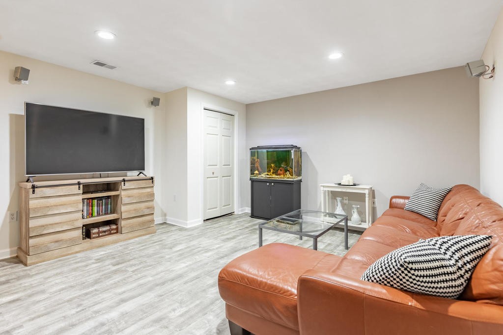 3 Elginwood Road, Unit B Peabody, MA 01960 - Photo 26 of 30 a living room with furniture and a flat screen tv