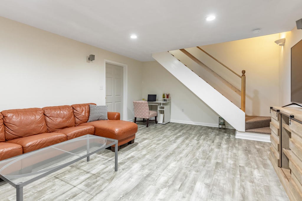 3 Elginwood Road, Unit B Peabody, MA 01960 - Photo 27 of 30 a living room with furniture and a wooden floor