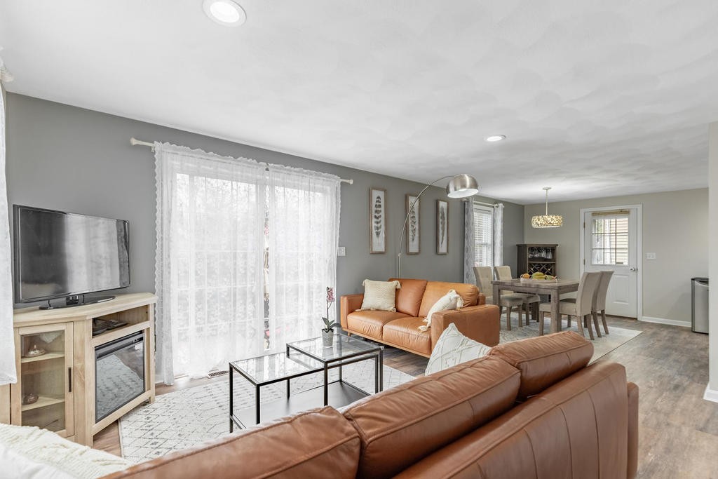 3 Elginwood Road, Unit B Peabody, MA 01960 - Photo 4 of 30 a living room with furniture and a flat screen tv