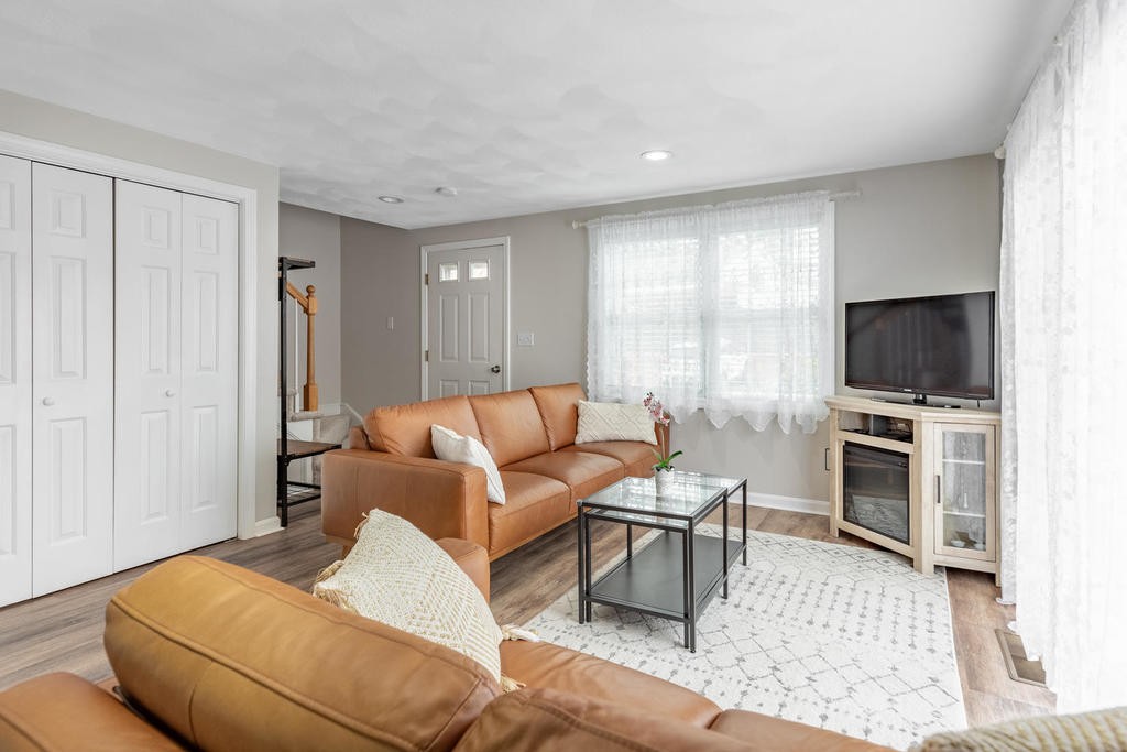 3 Elginwood Road, Unit B Peabody, MA 01960 - Photo 8 of 30 a living room with furniture and a flat screen tv
