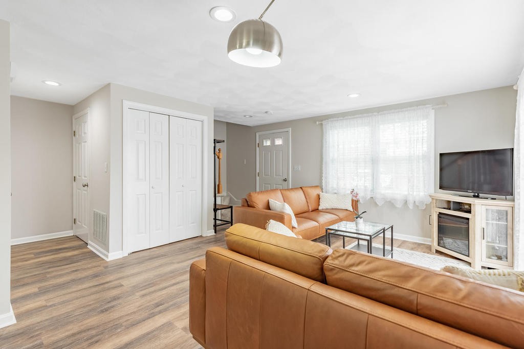 3 Elginwood Road, Unit B Peabody, MA 01960 - Photo 9 of 30 a living room with furniture and a flat screen tv
