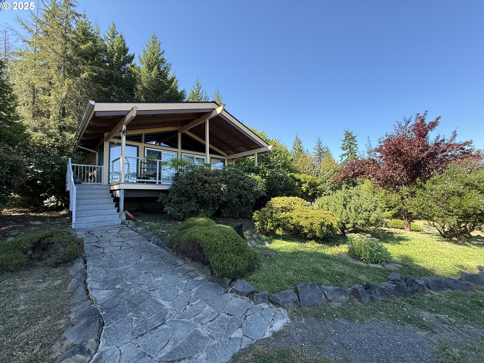 a view of a chair and table in the garden