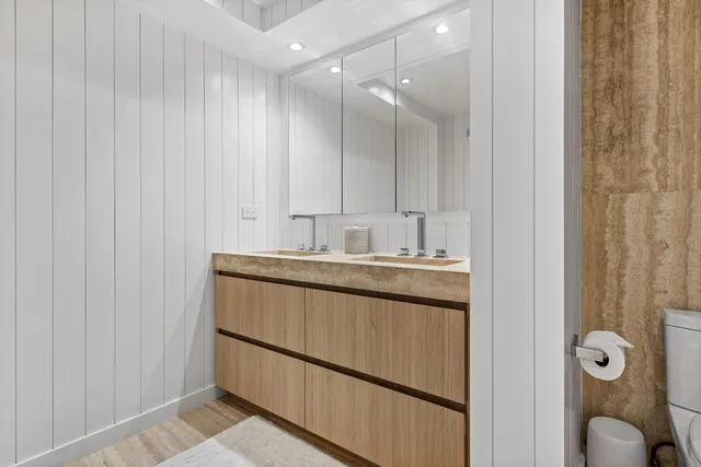 a bathroom with a sink and mirror