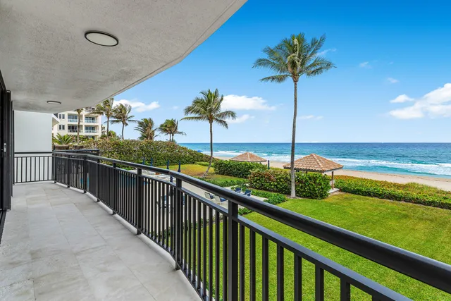 a view of a balcony with a swimming pool