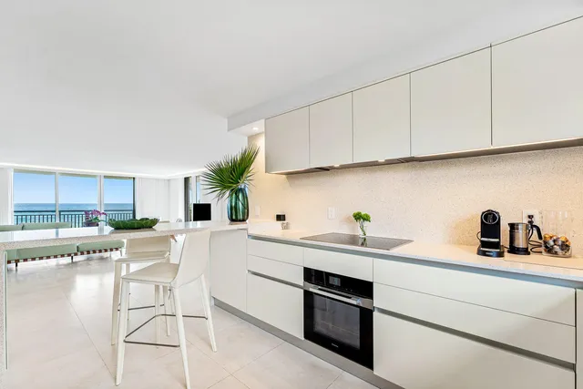 a kitchen with stainless steel appliances granite countertop a refrigerator sink and cabinets