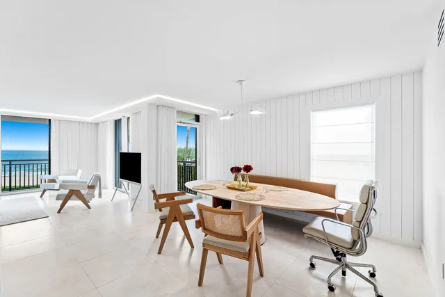 a dining room with furniture and window
