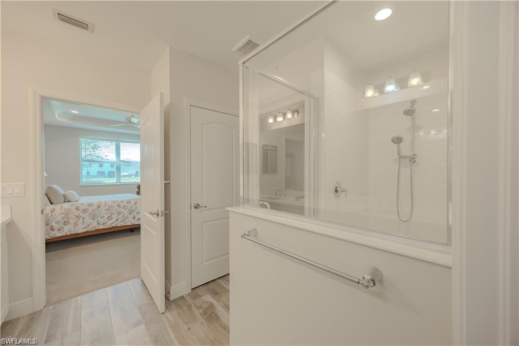 2335 Sawyers Hill Road, Unit 503 Naples, FL 34120 - Photo 13 of 23 a en suite bathroom with a shower