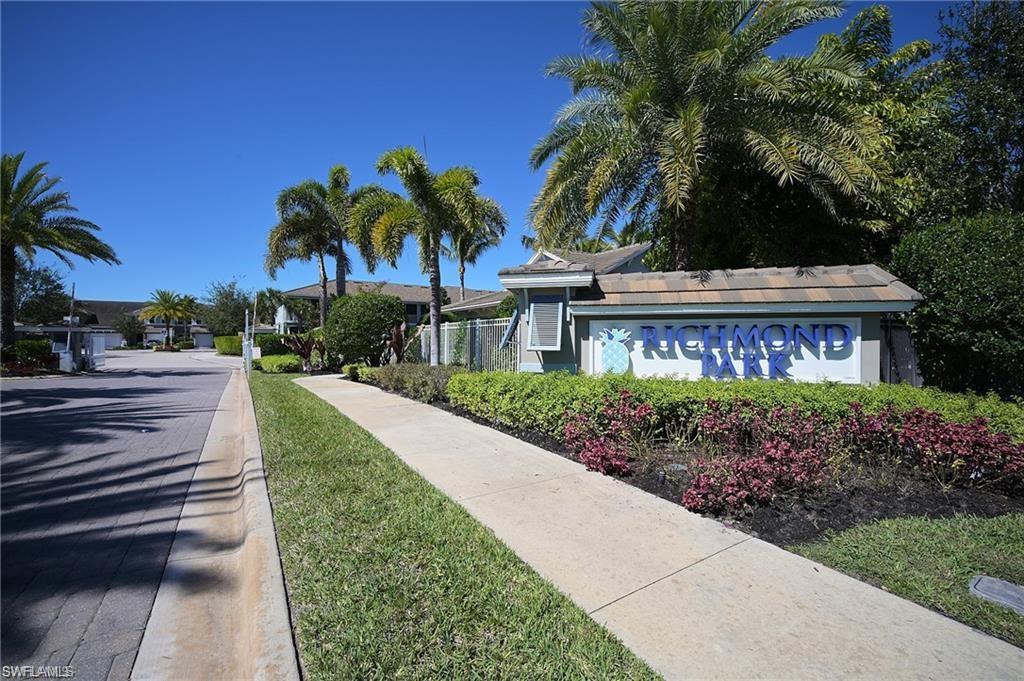 2335 Sawyers Hill Road, Unit 503 Naples, FL 34120 - Photo 16 of 23 a view of a house with a yard and potted plants