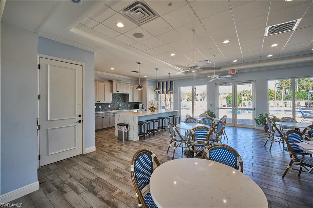 2335 Sawyers Hill Road, Unit 503 Naples, FL 34120 - Photo 17 of 23 a very nice looking living room with a large window