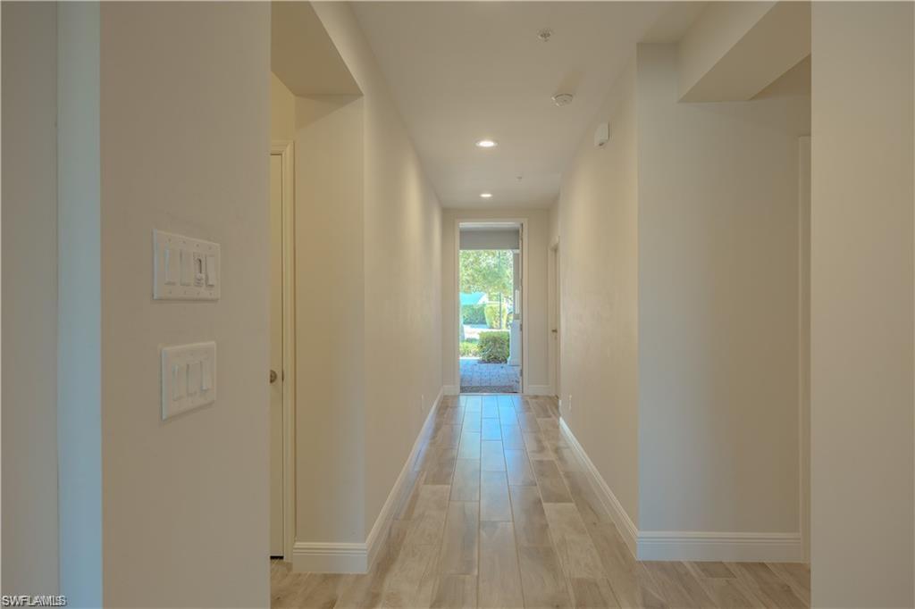 2335 Sawyers Hill Road, Unit 503 Naples, FL 34120 - Photo 7 of 23 a view of a hallway with wooden floor