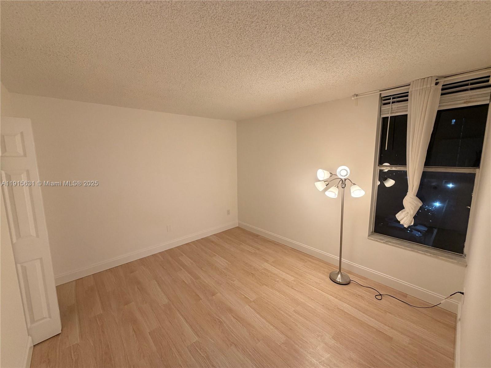 2350 Northeast 135th Street, Unit 503 North Miami, FL 33181 - Photo 7 of 9 a view of an empty room