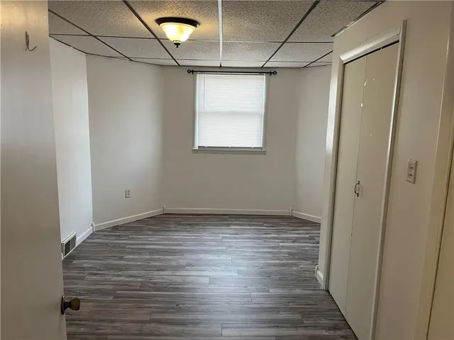a view of a room with wooden floor