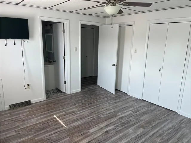 a view of a livingroom with wooden floor