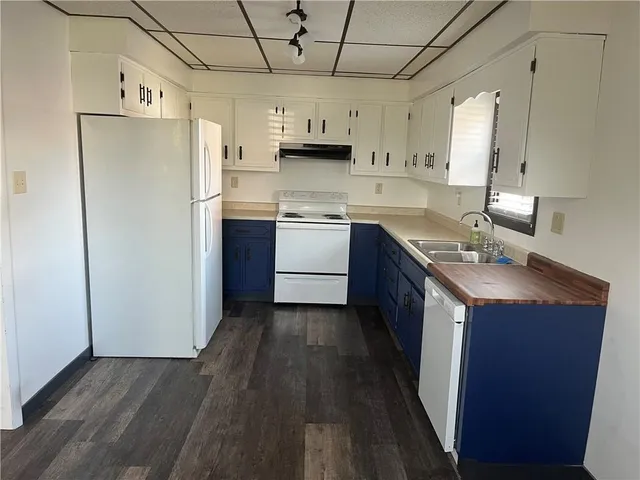 a kitchen with stainless steel appliances a refrigerator and a stove