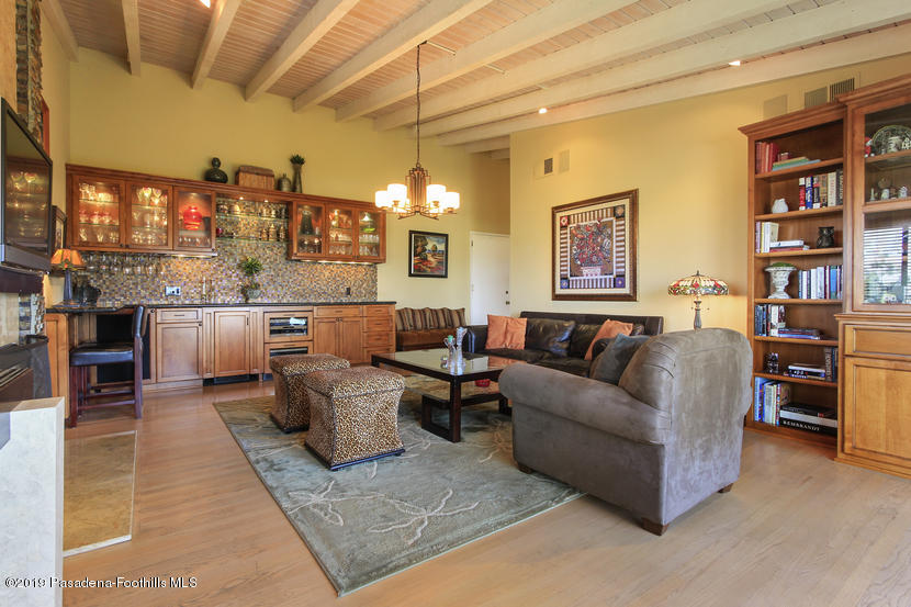 943 Glen Oaks Boulevard Pasadena, CA 91105 - Photo 12 of 38 a living room with furniture and kitchen view