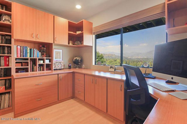a kitchen with stainless steel appliances a sink and cabinets
