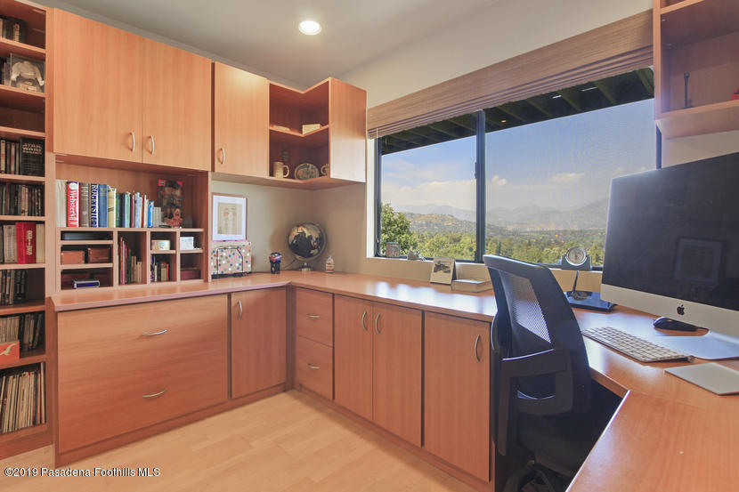 943 Glen Oaks Boulevard Pasadena, CA 91105 - Photo 28 of 38 a kitchen with stainless steel appliances a sink and cabinets