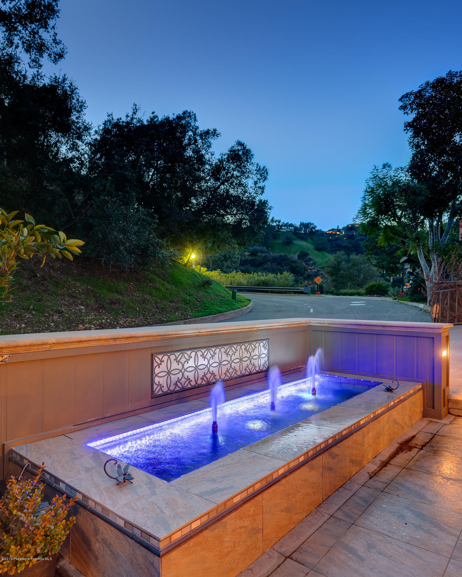 943 Glen Oaks Boulevard Pasadena, CA 91105 - Photo 4 of 38 a view of a bench in a backyard
