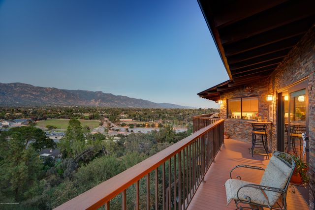 a view of a balcony with chairs
