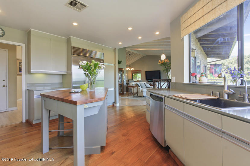 943 Glen Oaks Boulevard Pasadena, CA 91105 - Photo 7 of 38 a kitchen with counter top space and windows