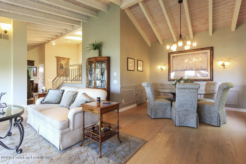 943 Glen Oaks Boulevard Pasadena, CA 91105 - Photo 10 of 38 a living room with furniture and a chandelier