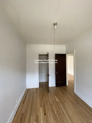a view of a kitchen with a wooden floor
