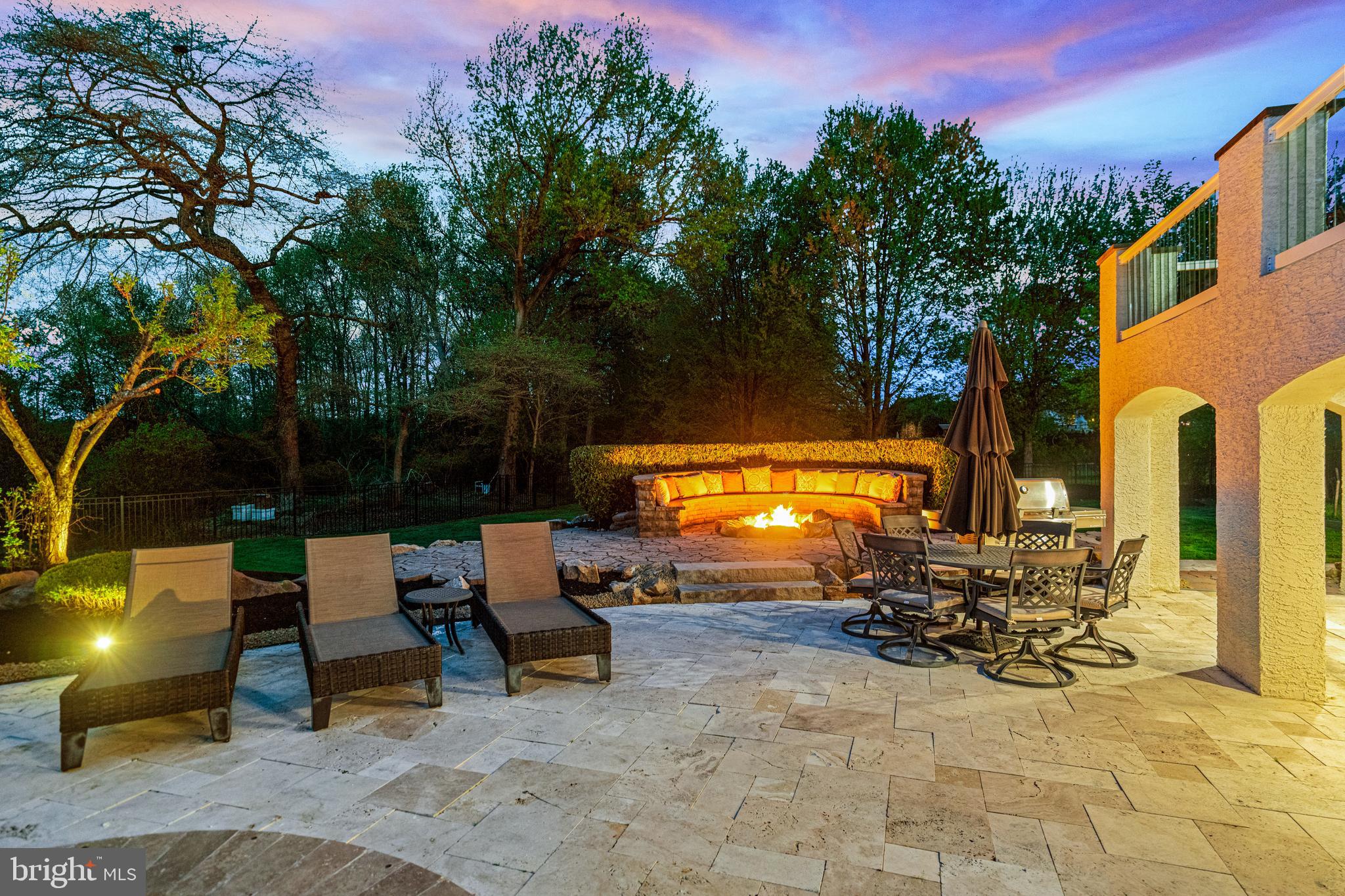 61 Brooks Road Moorestown, NJ 08057 - Photo 15 of 93 a view of a patio with table and chairs with a yard and plants