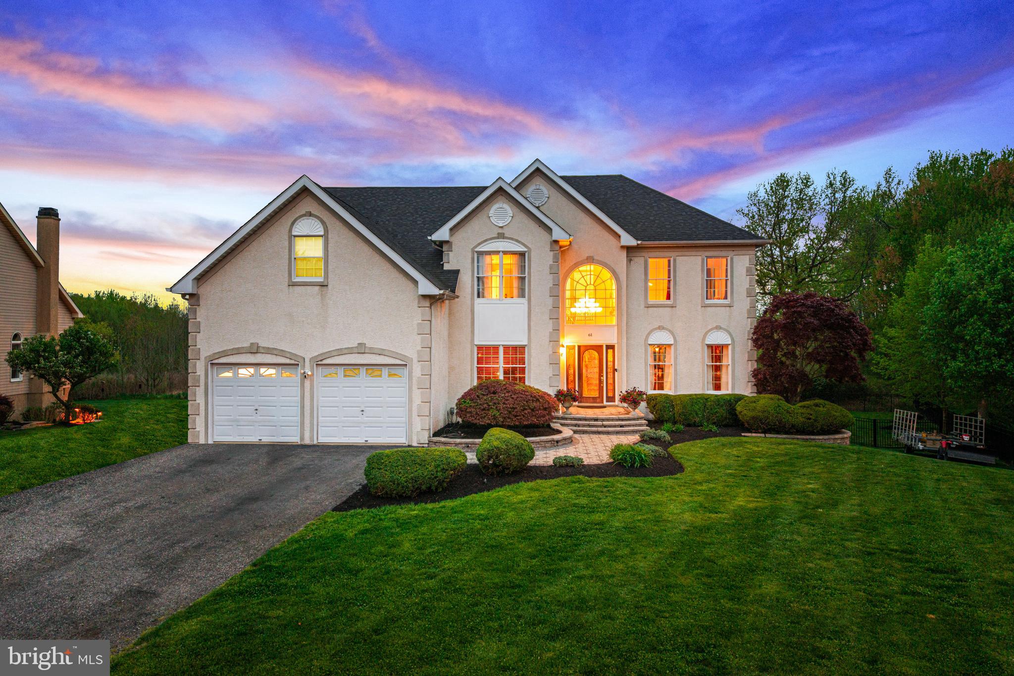 61 Brooks Road Moorestown, NJ 08057 - Photo 17 of 93 a front view of a house with a yard and garage