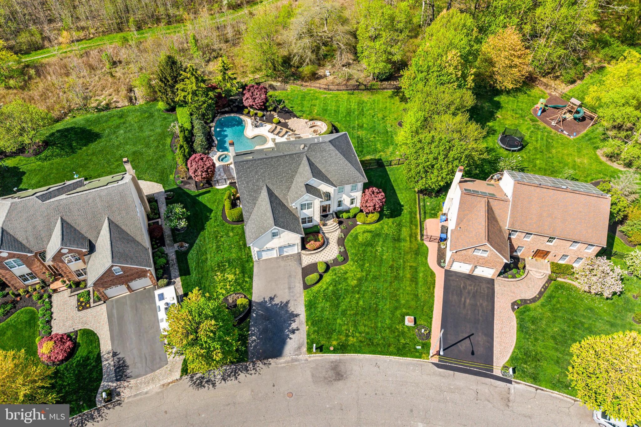 61 Brooks Road Moorestown, NJ 08057 - Photo 19 of 93 an aerial view of a house with a garden and swimming pool