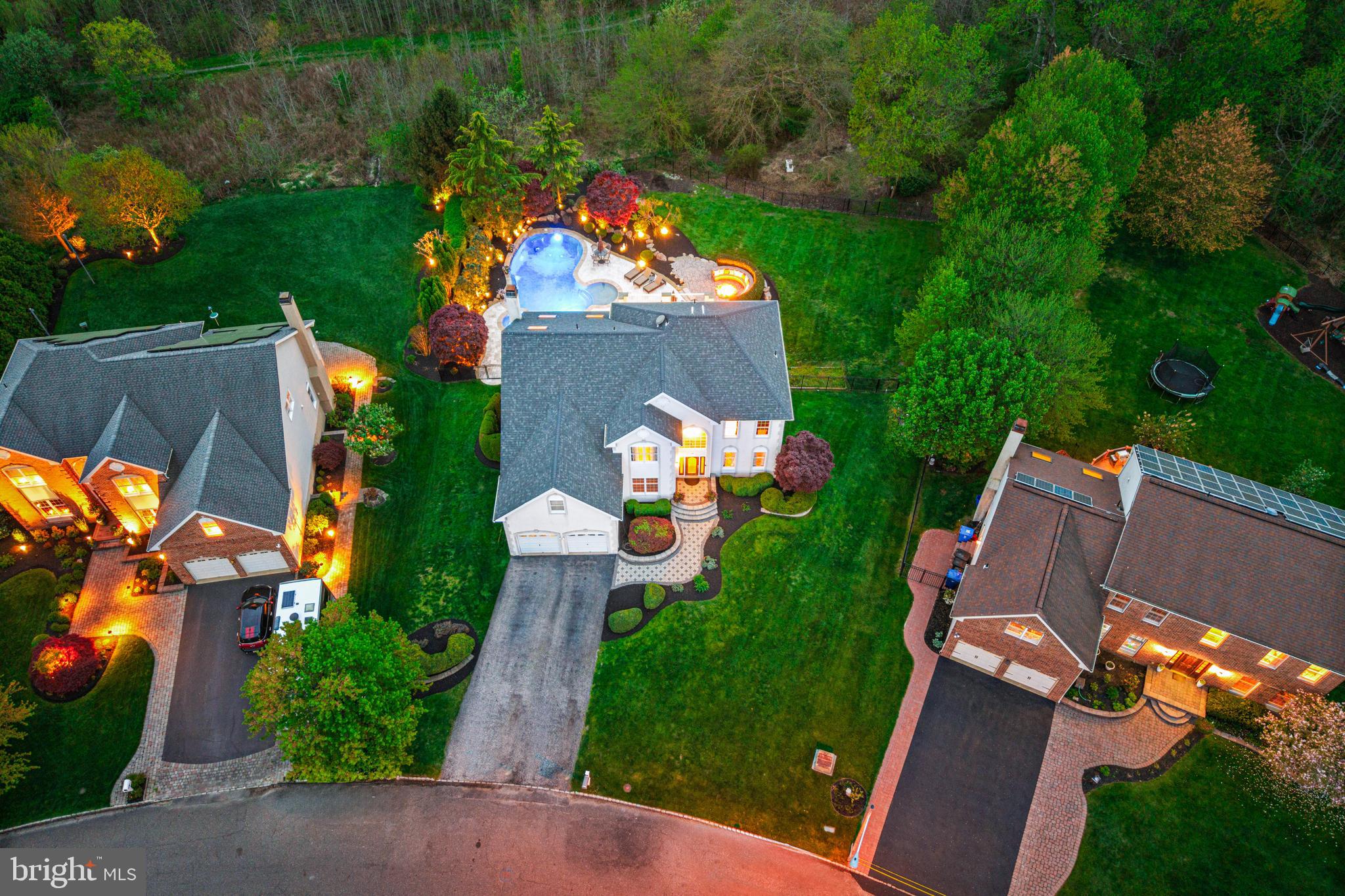 61 Brooks Road Moorestown, NJ 08057 - Photo 3 of 93 an aerial view of a house with a garden and swimming pool