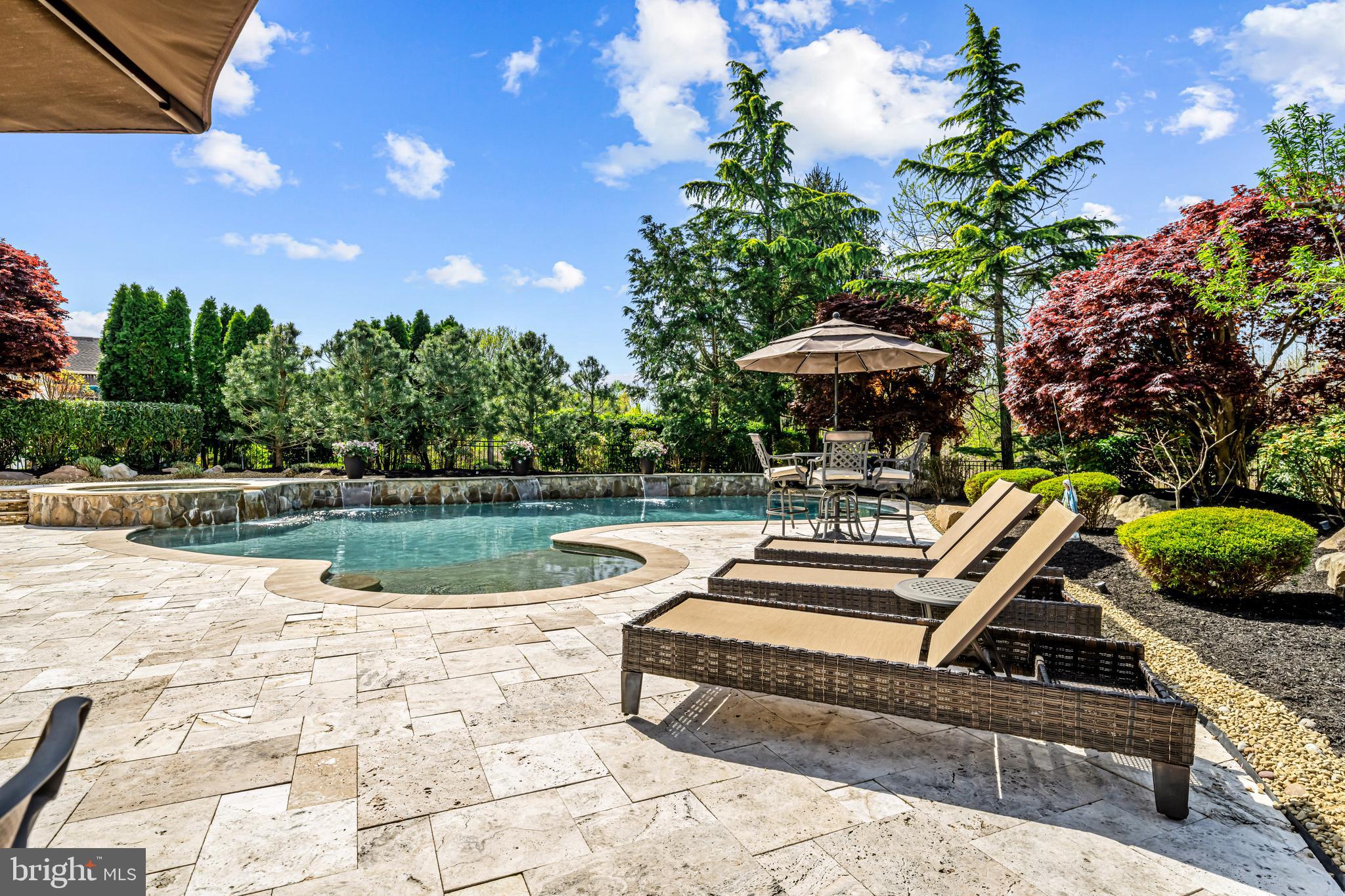 61 Brooks Road Moorestown, NJ 08057 - Photo 35 of 93 a view of a swimming pool with a patio