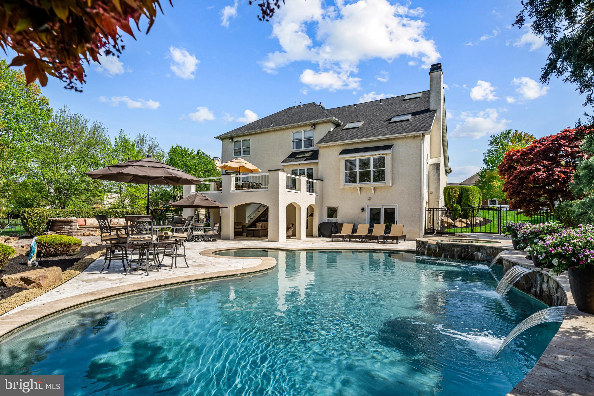 61 Brooks Road Moorestown, NJ 08057 - Photo 41 of 93 a front view of a house with swimming pool garden and patio