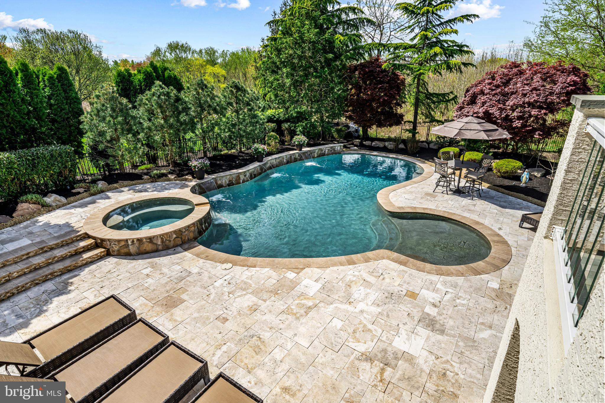 61 Brooks Road Moorestown, NJ 08057 - Photo 42 of 93 a view of a backyard with table and chairs potted plants and large tree