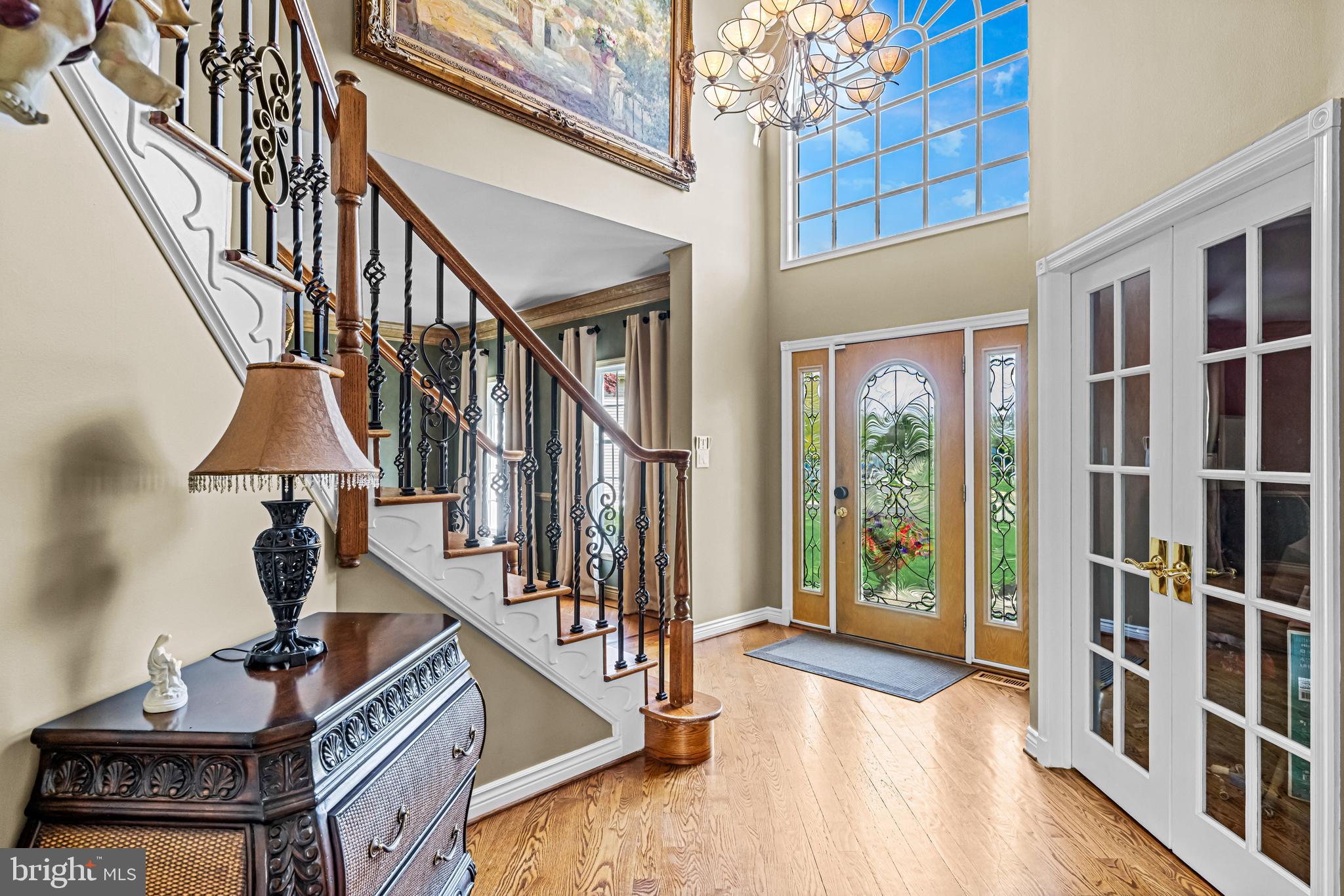 61 Brooks Road Moorestown, NJ 08057 - Photo 49 of 93 a view of staircase with lots of frames on wall and a window