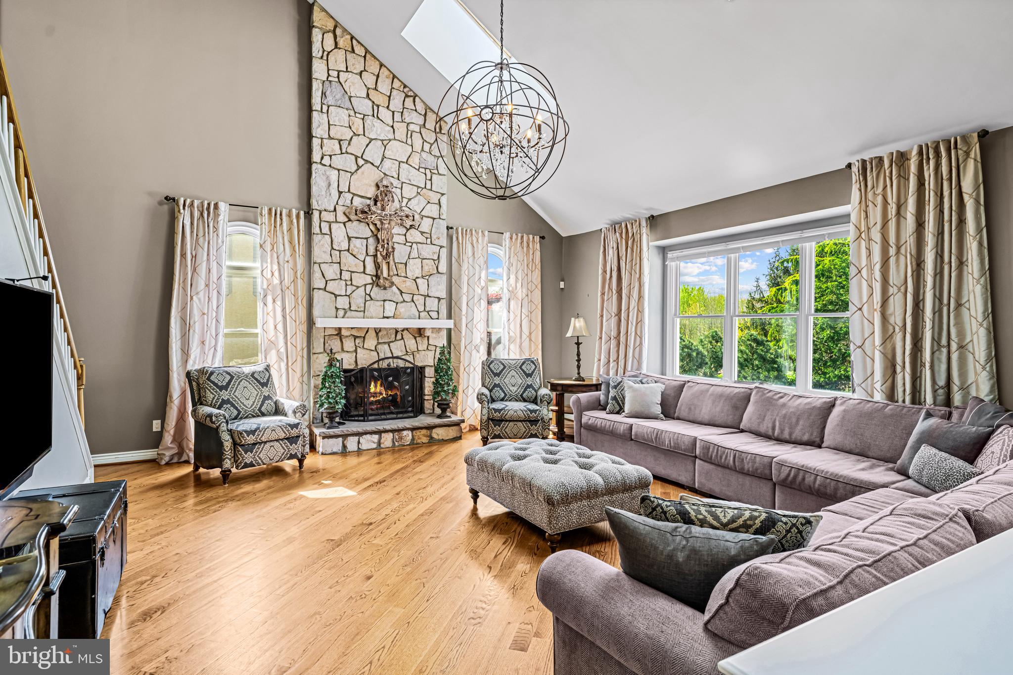 61 Brooks Road Moorestown, NJ 08057 - Photo 50 of 93 a living room with furniture a fireplace and a large window